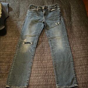 Distressed Blue Denim Jeans